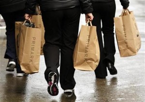 Shoppers carry Primark bags in London