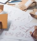 Designer sketching drawing design Brown craft cardboard paper pr